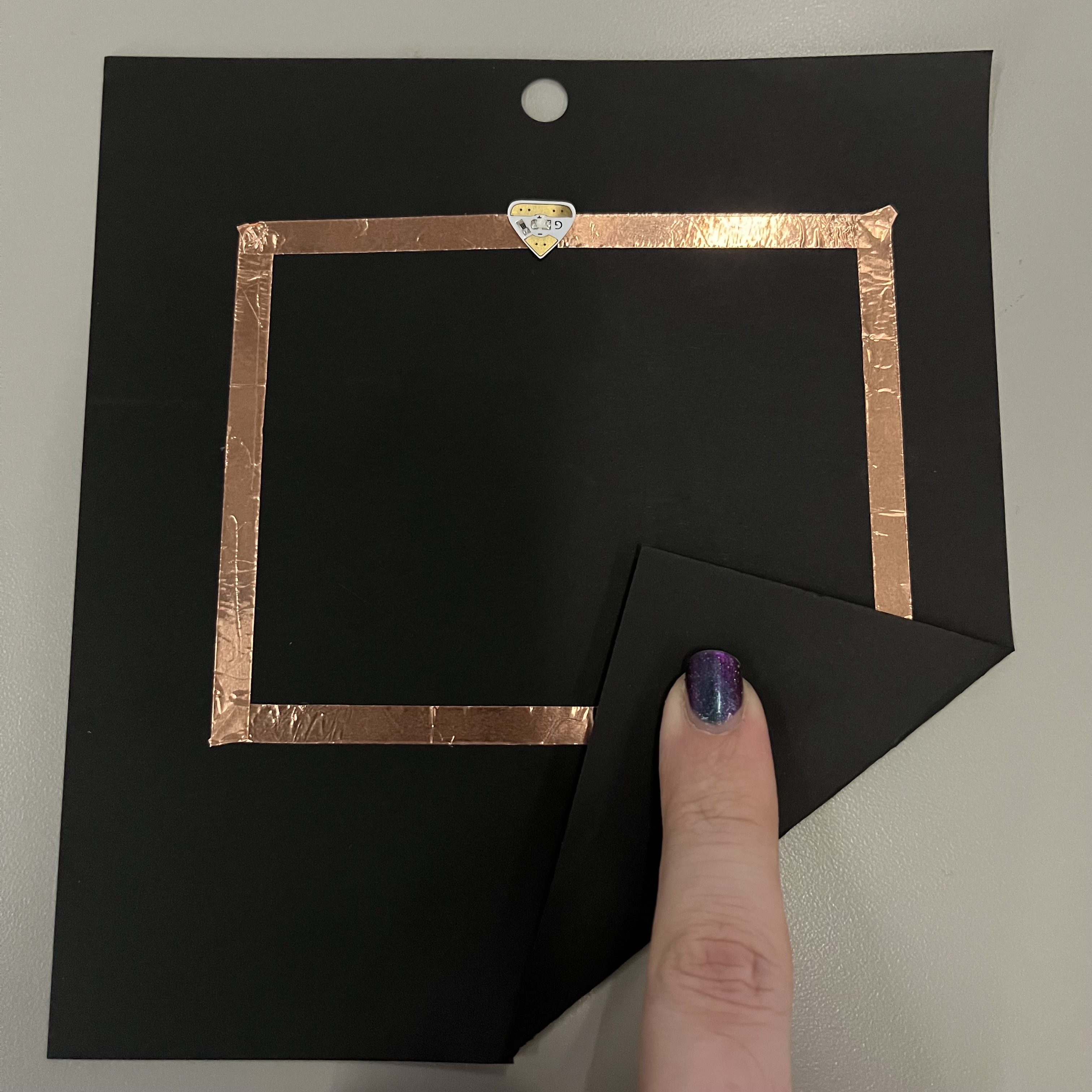 My first simple circuit did not work because I didn't leave a gap under the light, so it was 1 continuous strip of copper tape. I forgot to photograph this without the light though.