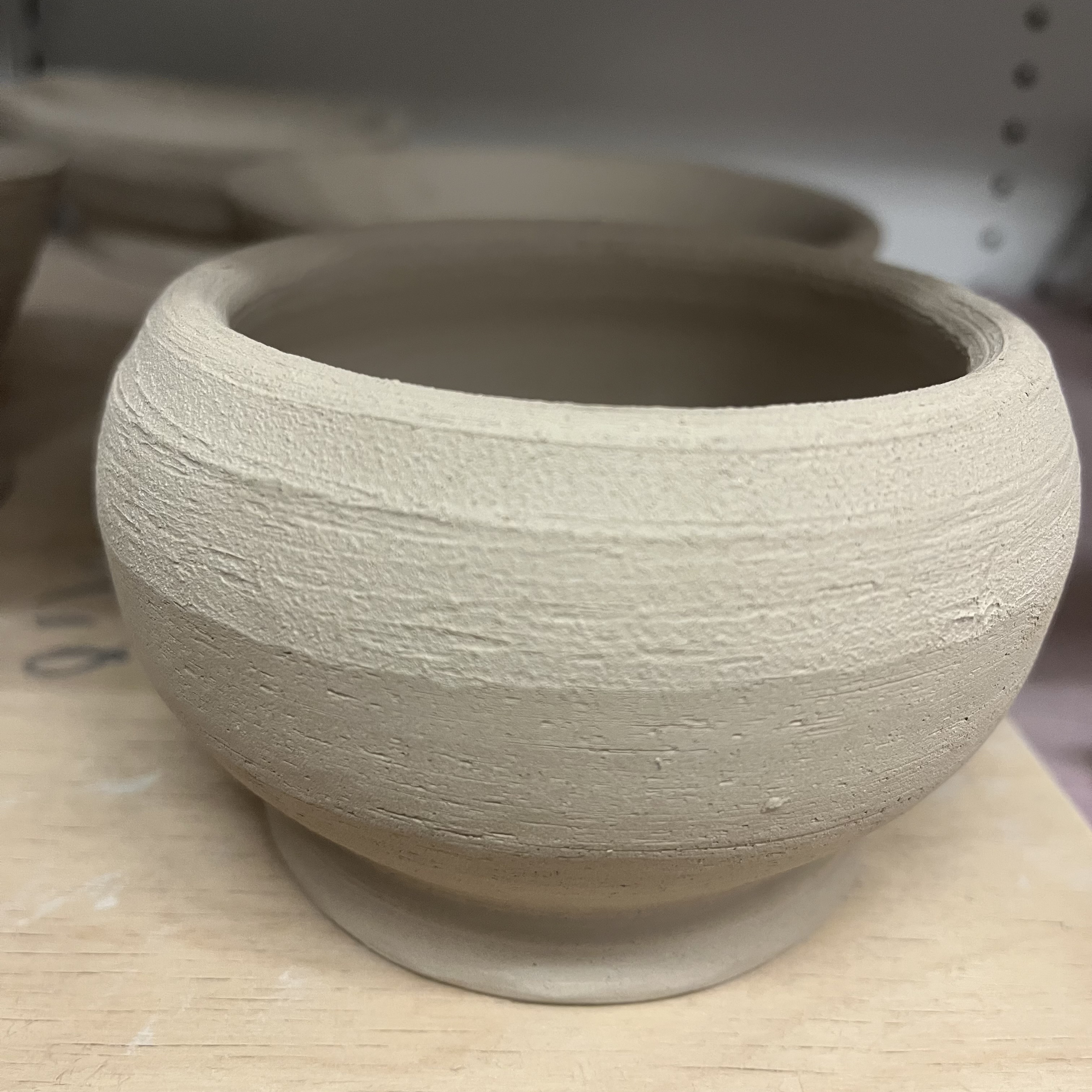 This is an air dried cone 10 pottery clay bowl. Cone 10 requires a higher temperature in the kiln to properly bake, than say a cone 4 or cone 6 clay. Cone 10 clay is used for it's durability and versatility, allowing artisans to make really beautiful work that if fired at the correct temperature will last a very long time. 