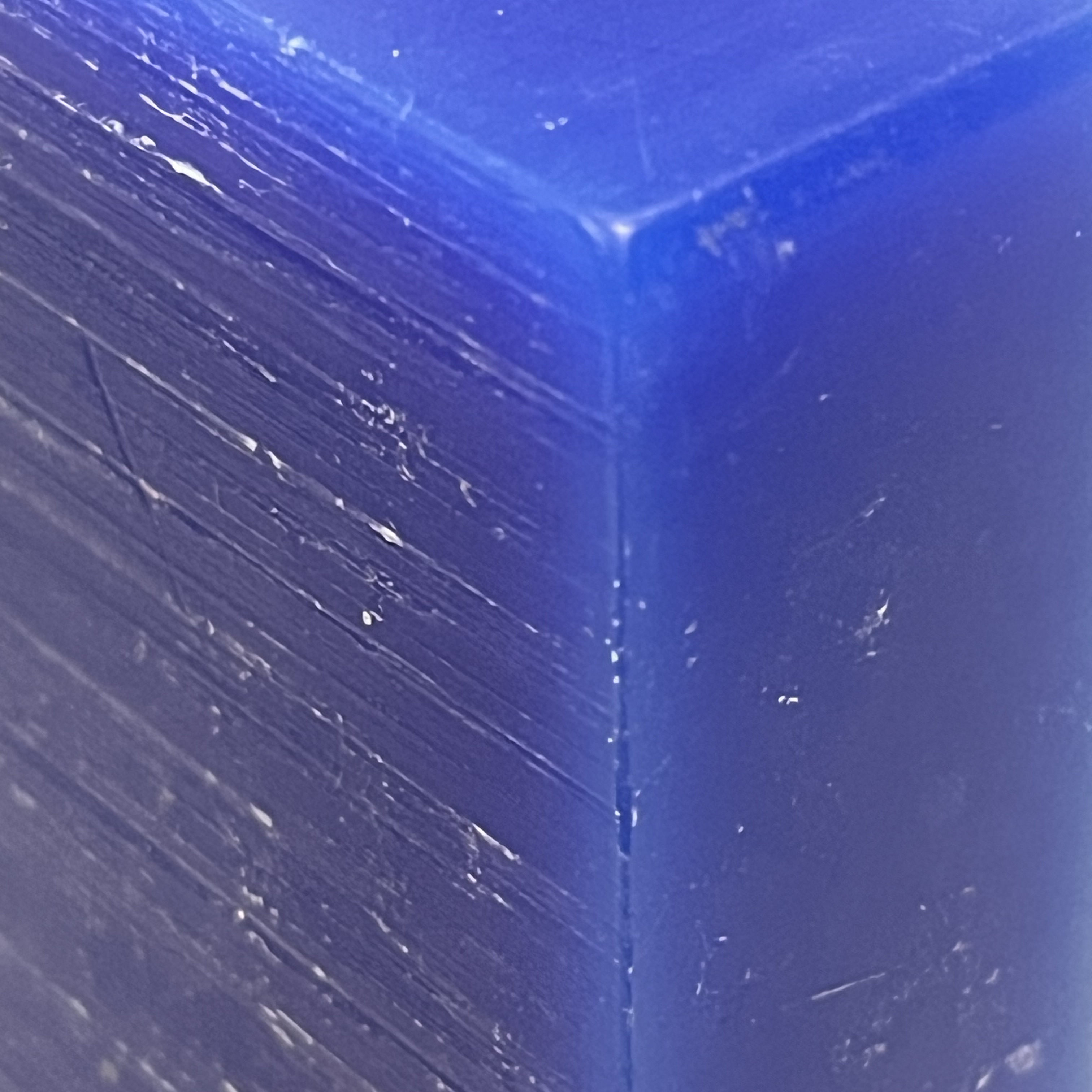 This material I believe is a resin like plastic block. It felt a little waxy which makes me think it's a resin. Anyway I like the linear pattern imprinted into the surface. I don't know how it was created, but it reminds me of brushed aluminum or other metals. There is also a nice contrast to the smooth side where there are no visible cuts in the surface, making me think this block might have been bigger and then cut down to size with a sharp blade. This texture reminds me a lot of home made candles, after they have been slimmed down with a knife.